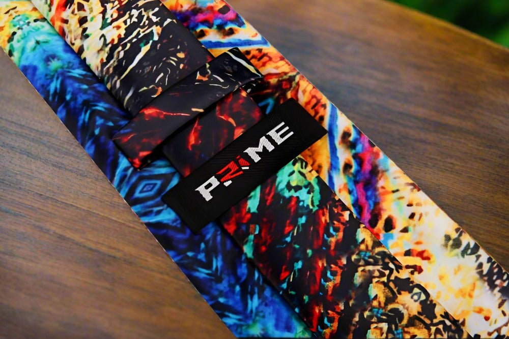 Close-up of a unique abstract watercolor silk tie in blue and yellow tones, perfect for business attire.