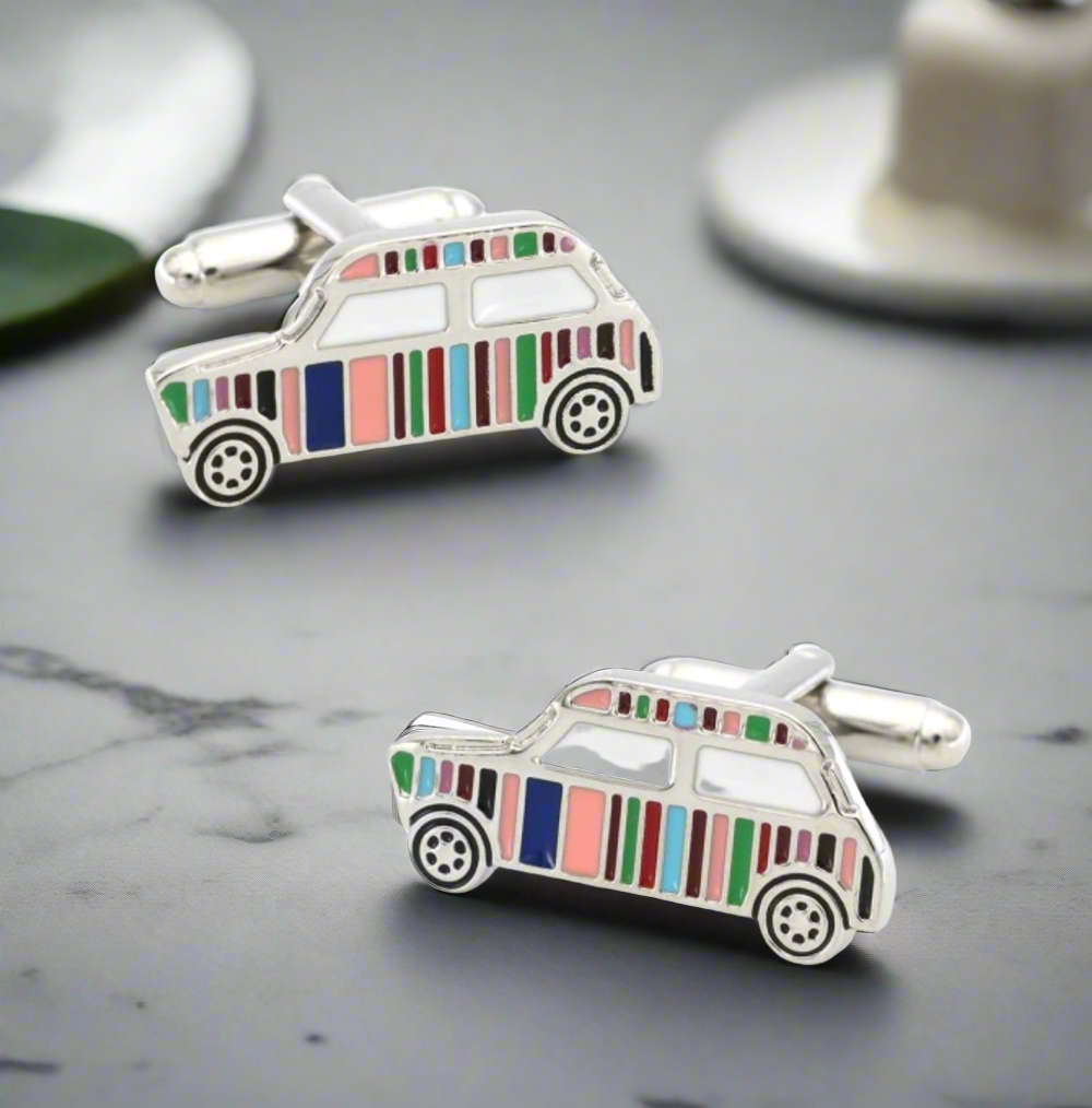 Close-up of vintage car cufflinks in vibrant colors, perfect for dress shirts.