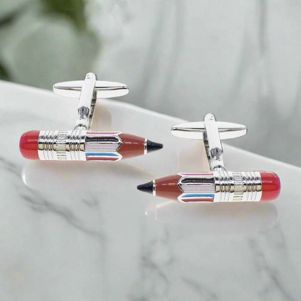 Close-up of colorful pencil cufflinks on a white dress shirt for weddings