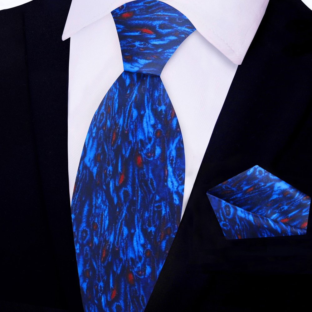 Man wearing watercolor silk necktie with a navy suit during a business meeting