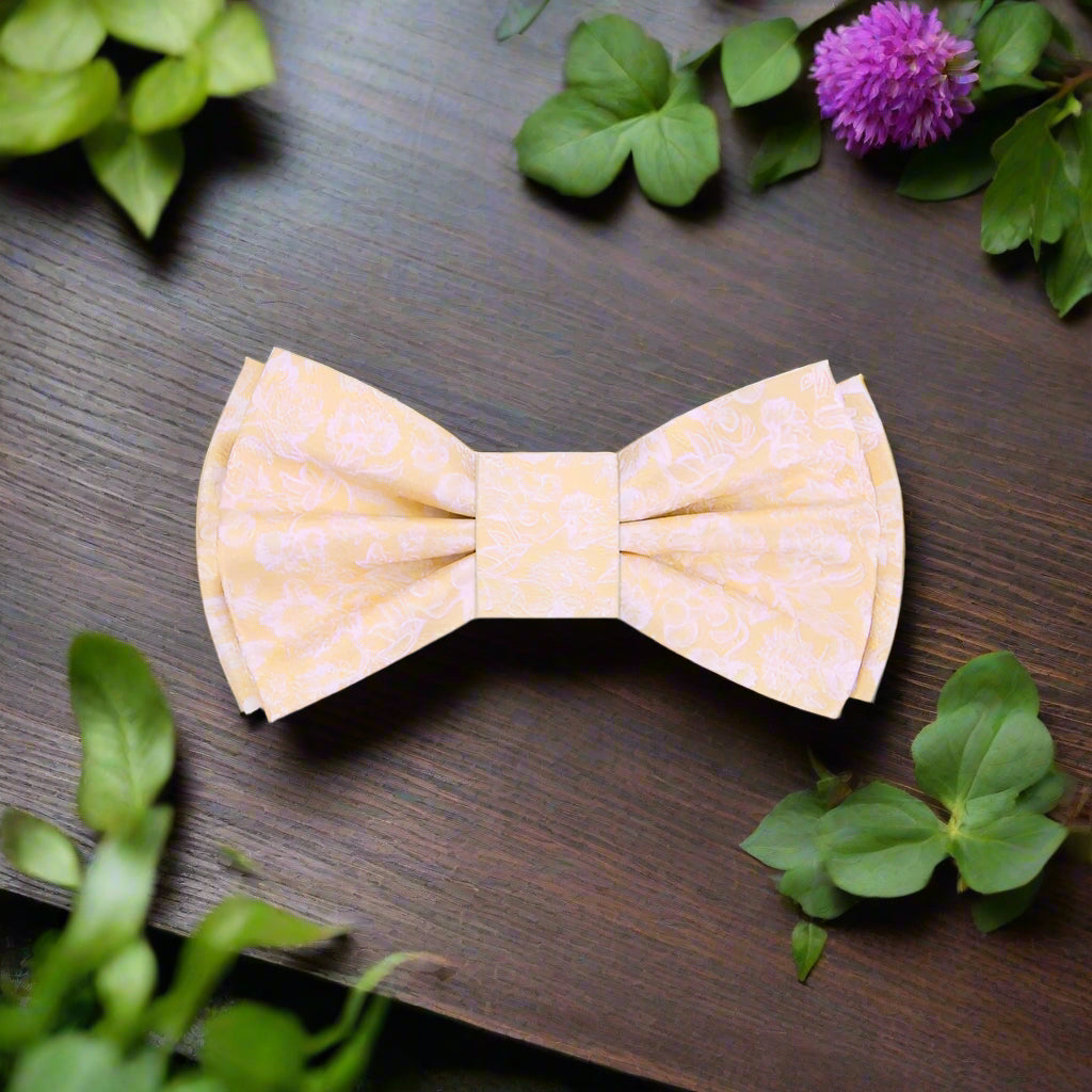 Elegant black silk bow tie with intricate filigree design, perfect for weddings