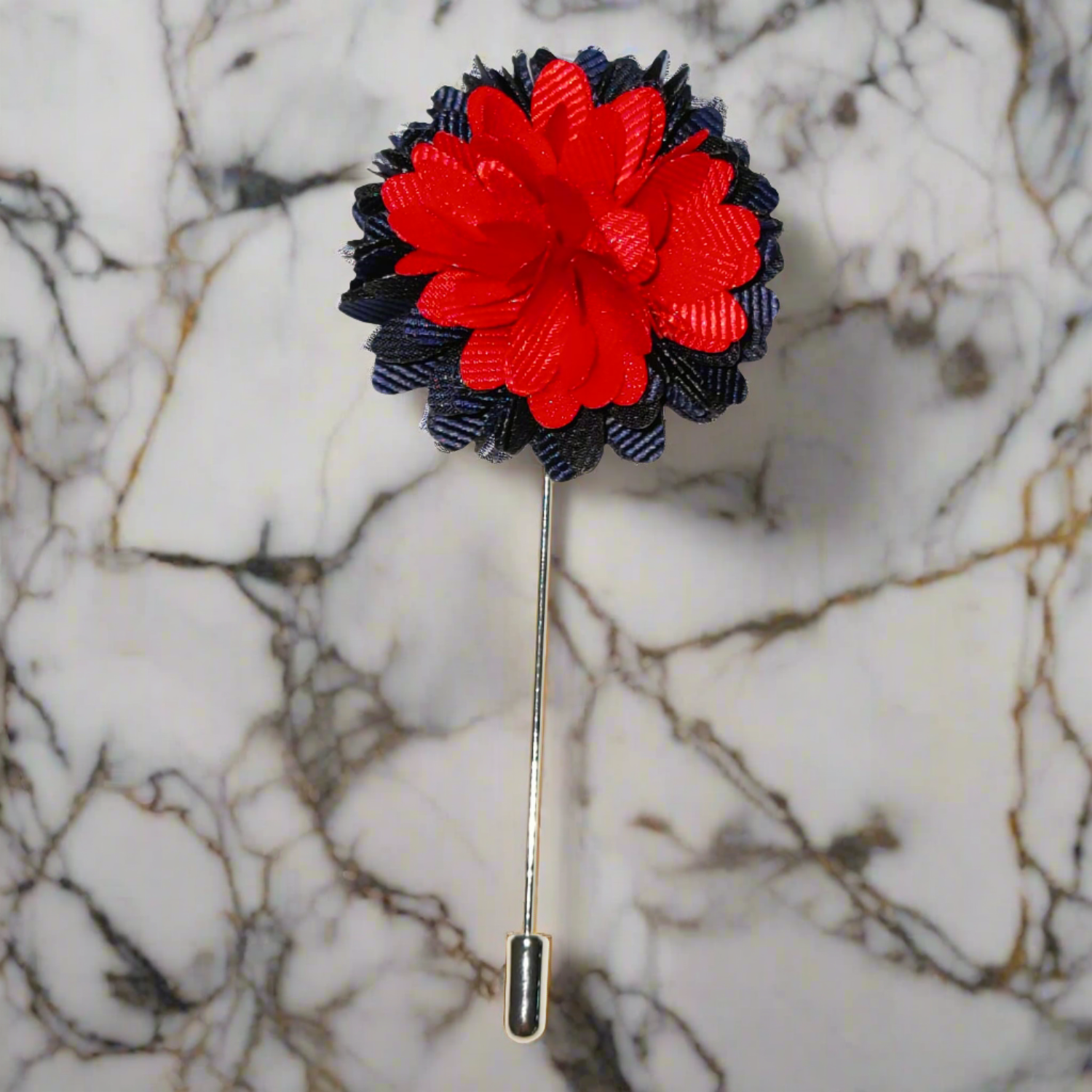 Vibrant blue and red floral lapel pin on a men's suit