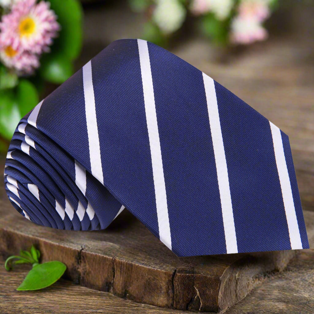 Close-up of the Elegant Blue Stripe Silk Necktie showcasing the white stripes against a dark blue background.