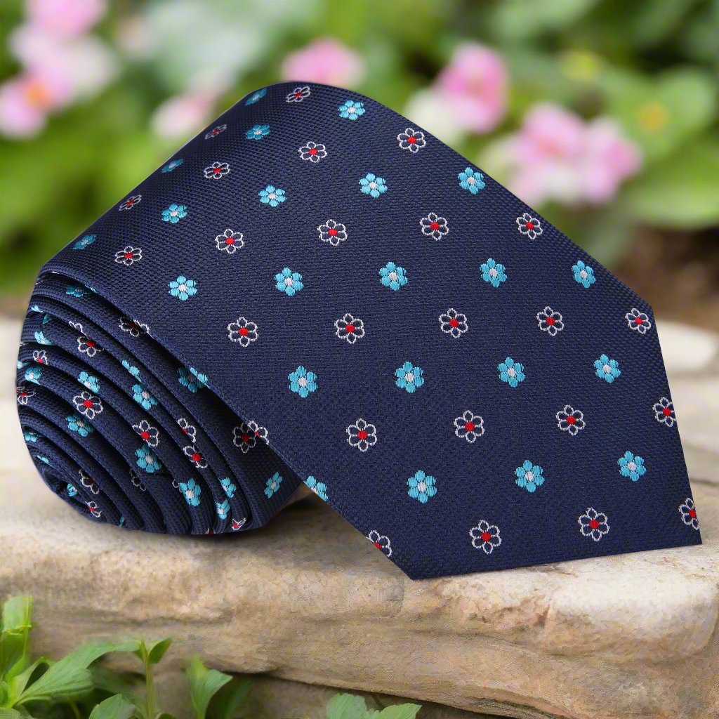 Close-up of floral silk necktie with small red and blue flowers, perfect for formal events