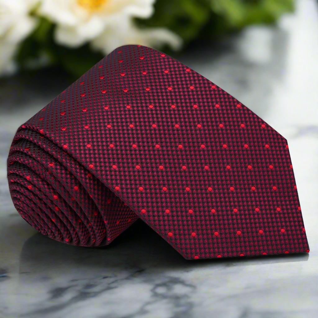 Close-up of dark red men's silk polka dot necktie with detailed pattern