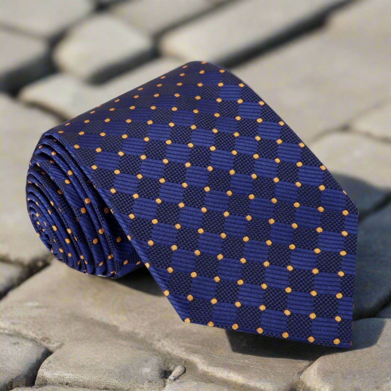 Close-up of the luxury geometric silk necktie with bold pattern and vibrant colors