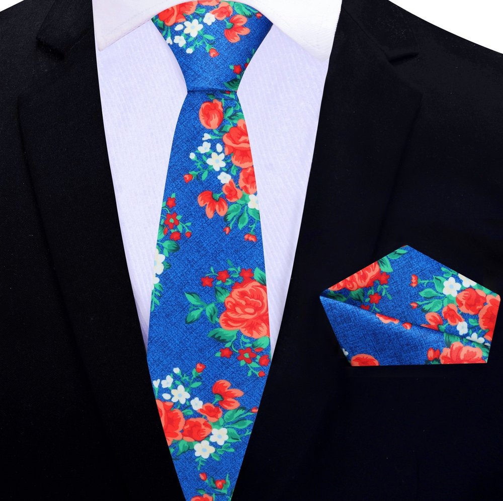 Elegant Floral Silk Necktie styled with a charcoal grey suit, demonstrating its versatility for formal events.