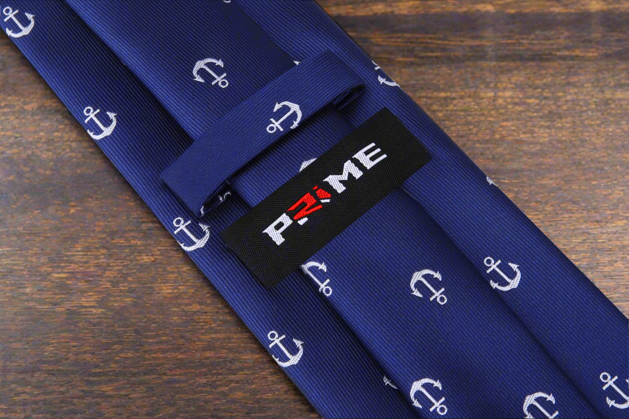 Close-up of the anchor pattern on the silk navy blue tie suitable for yacht parties