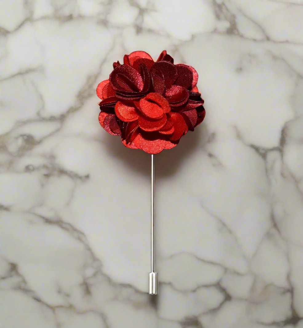 Collection of multi colored lapel pins, including flower and leaf designs, for accessories