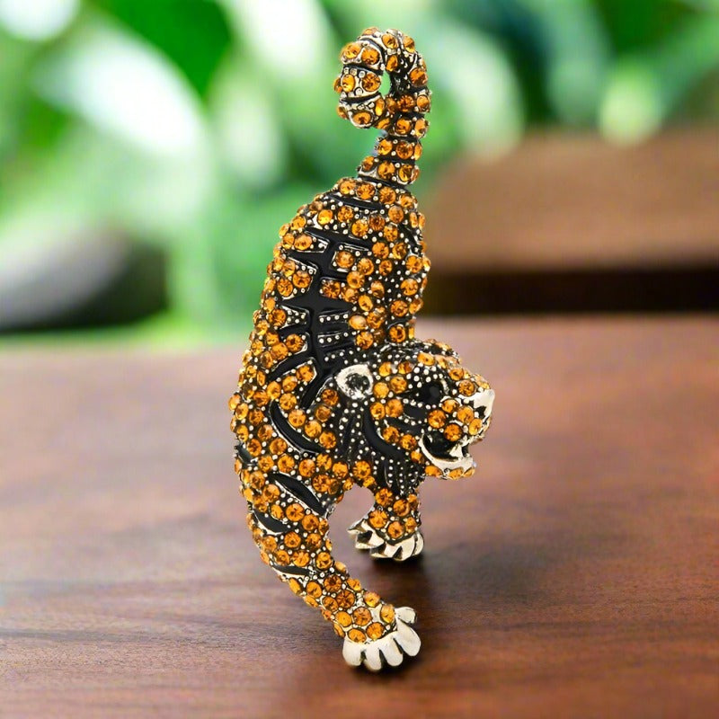 Close-up of a gemstone lion lapel pin with detailed craftsmanship