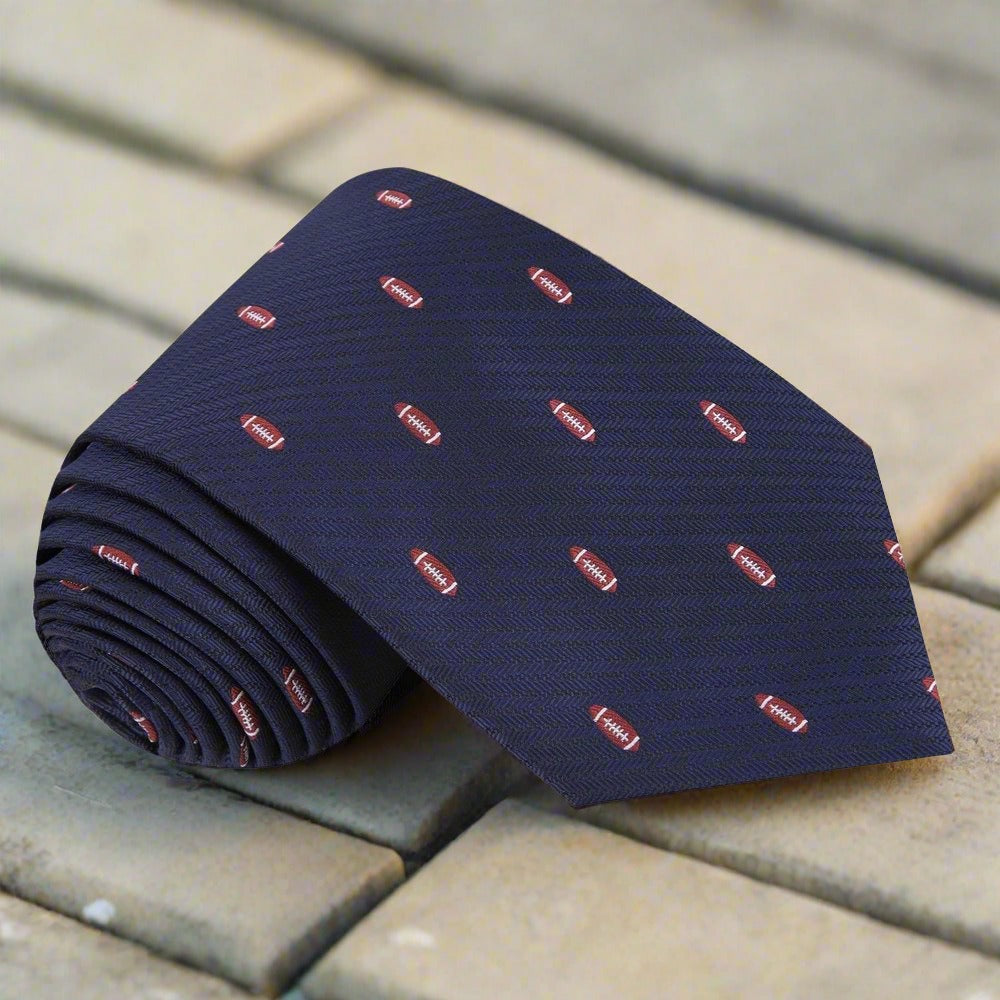 Close-up of football-themed silk necktie with vibrant blue background, perfect for game day parties