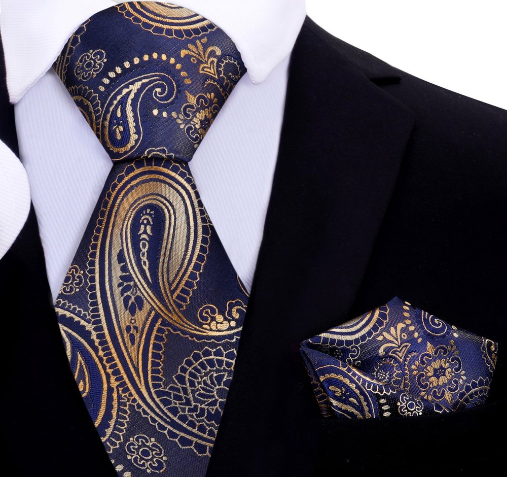 Close-up of dark blue paisley tie for boys with gold accents, perfect for formal wear