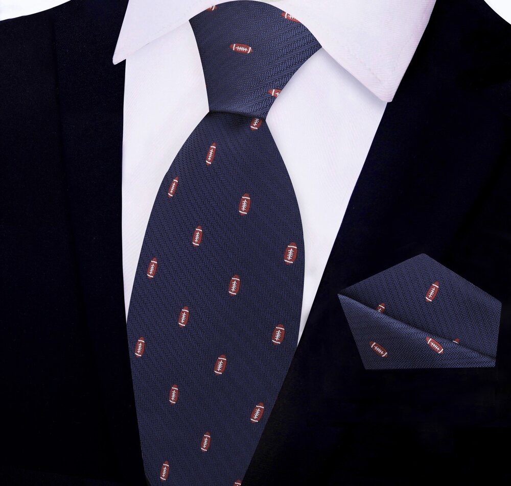 Close-up of the silk tie showing detailed football pattern on blue fabric