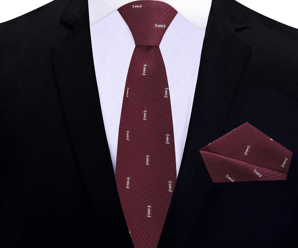 Styled football tie paired with a pale blue shirt and charcoal suit for office wear