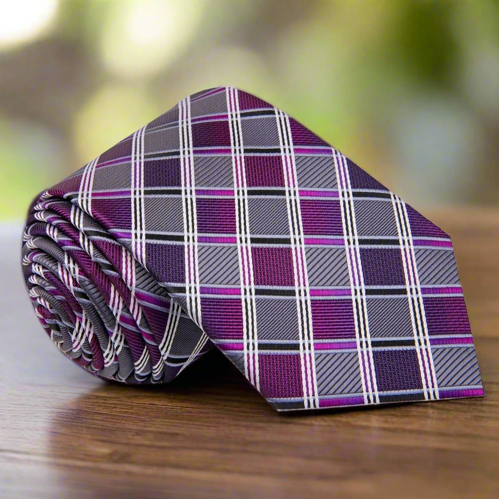 Elegant grey and purple silk tie with stripe pattern on a dress shirt