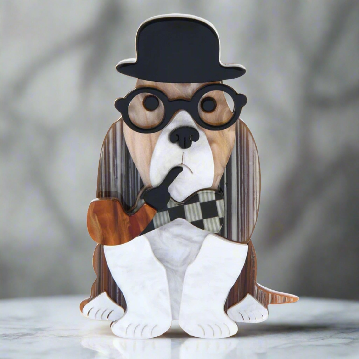 Close-up of the whimsical detective dog lapel pin showcasing its colorful design.