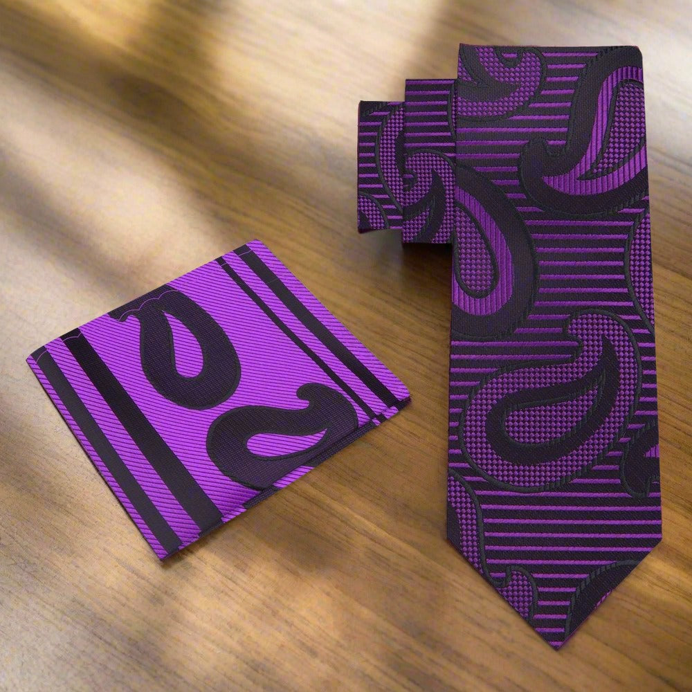 Silk paisley tie styled with a crisp white shirt and navy blazer