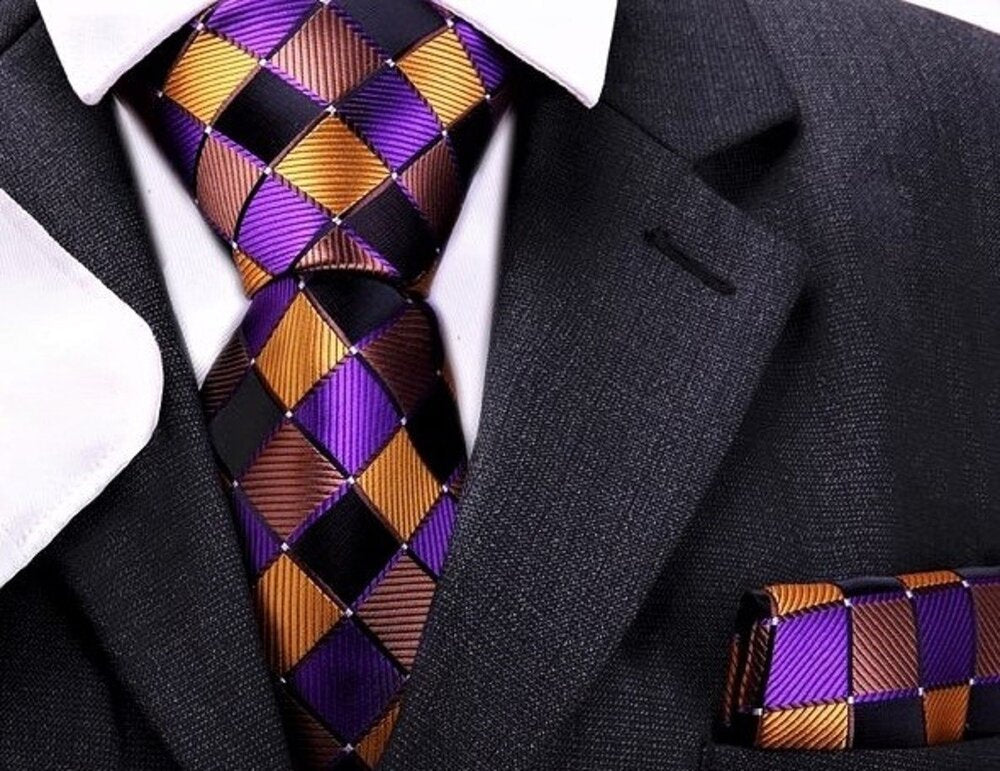 Front view of kids self tie bow tie and pocket square set showcasing purple, gold, and brown geometric design.