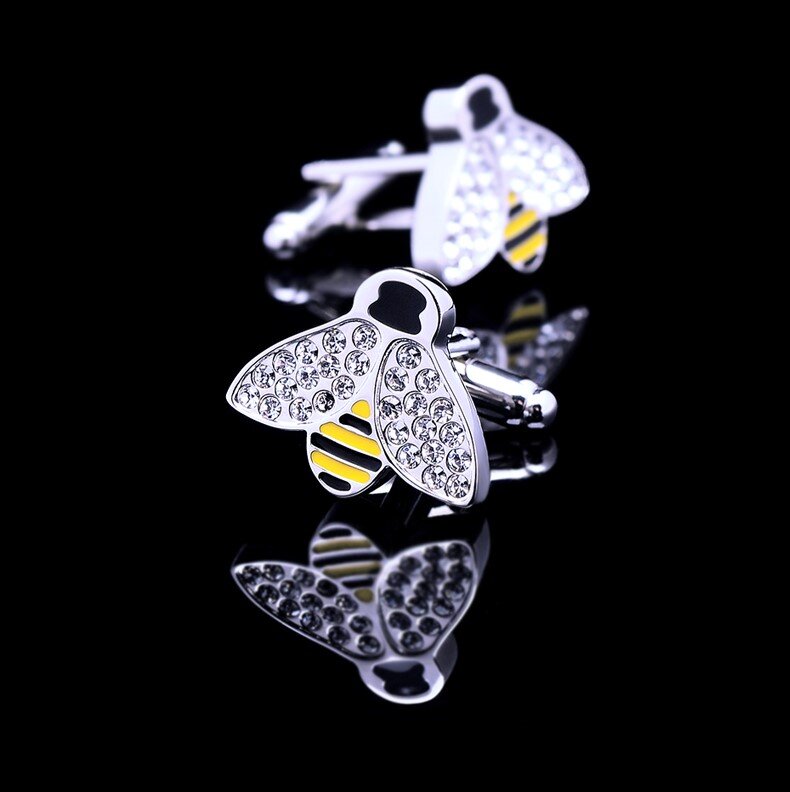 Stylish pairing of wildlife cufflinks with a light green dress shirt