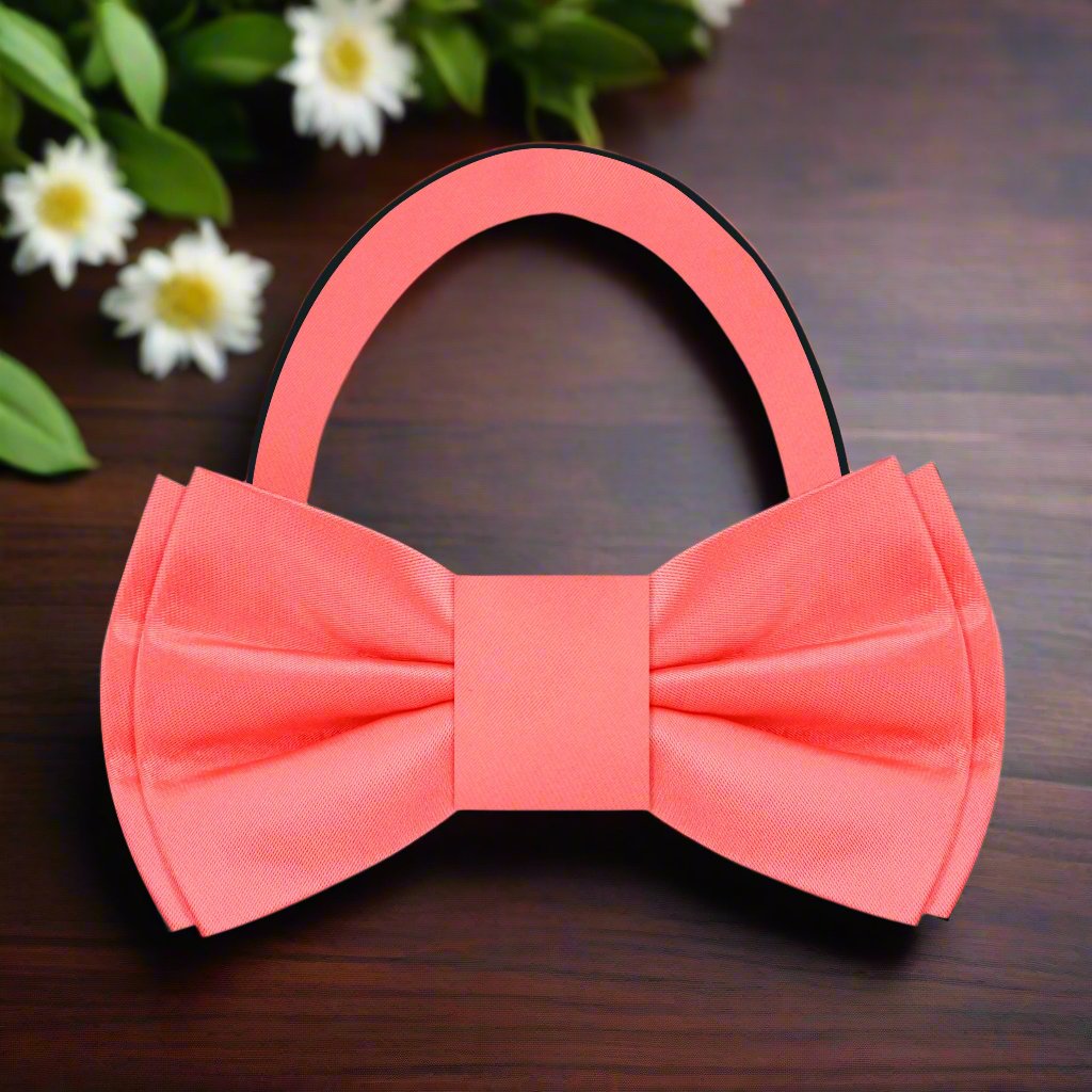 Pre-tied silk bow tie in rich coral, ideal for formal events.