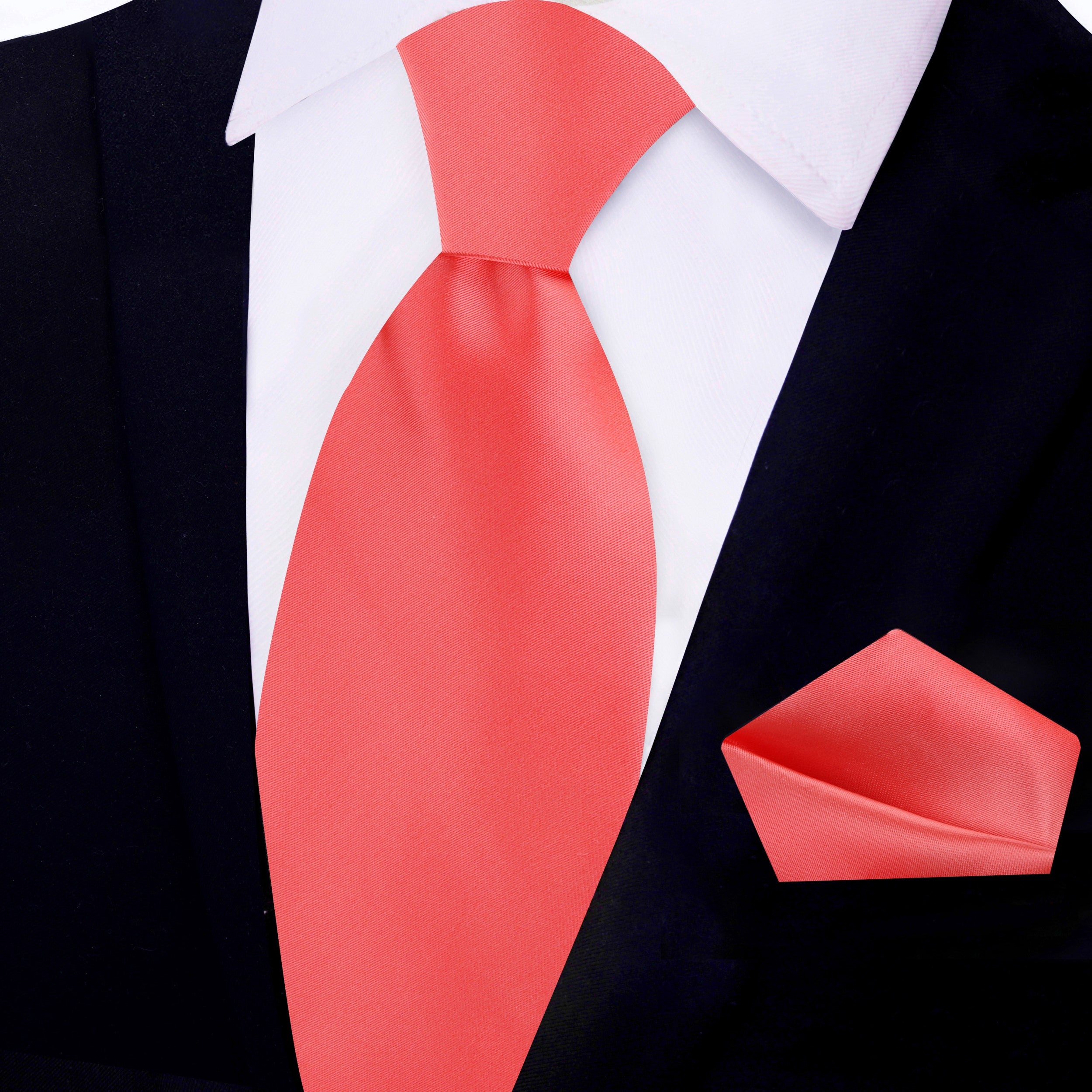 Close-up of a luxurious silk tie in deep navy, highlighting its fine craftsmanship and sheen.