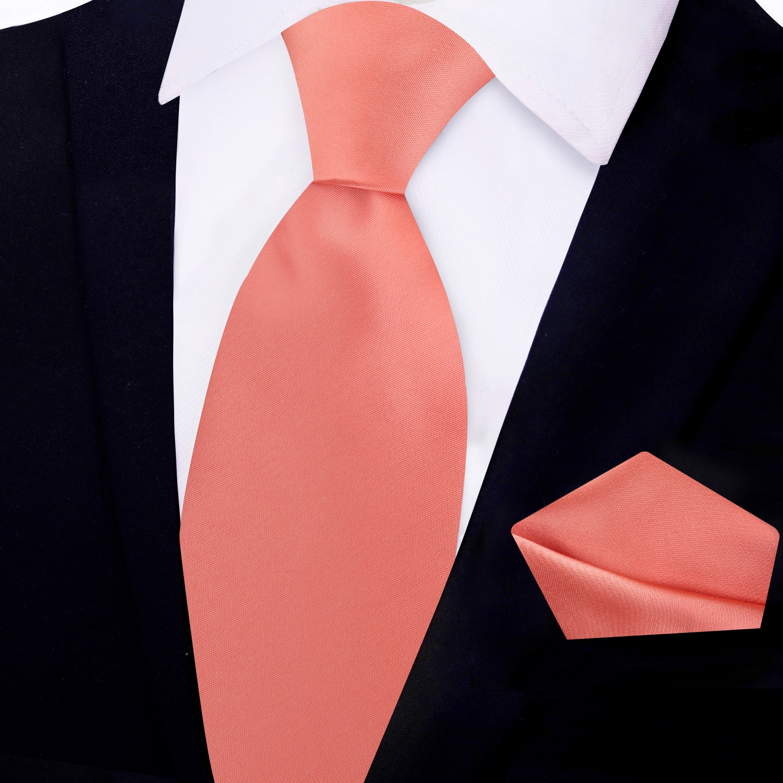 Close-up of a luxurious silk tie in deep navy, highlighting its fine craftsmanship and sheen.