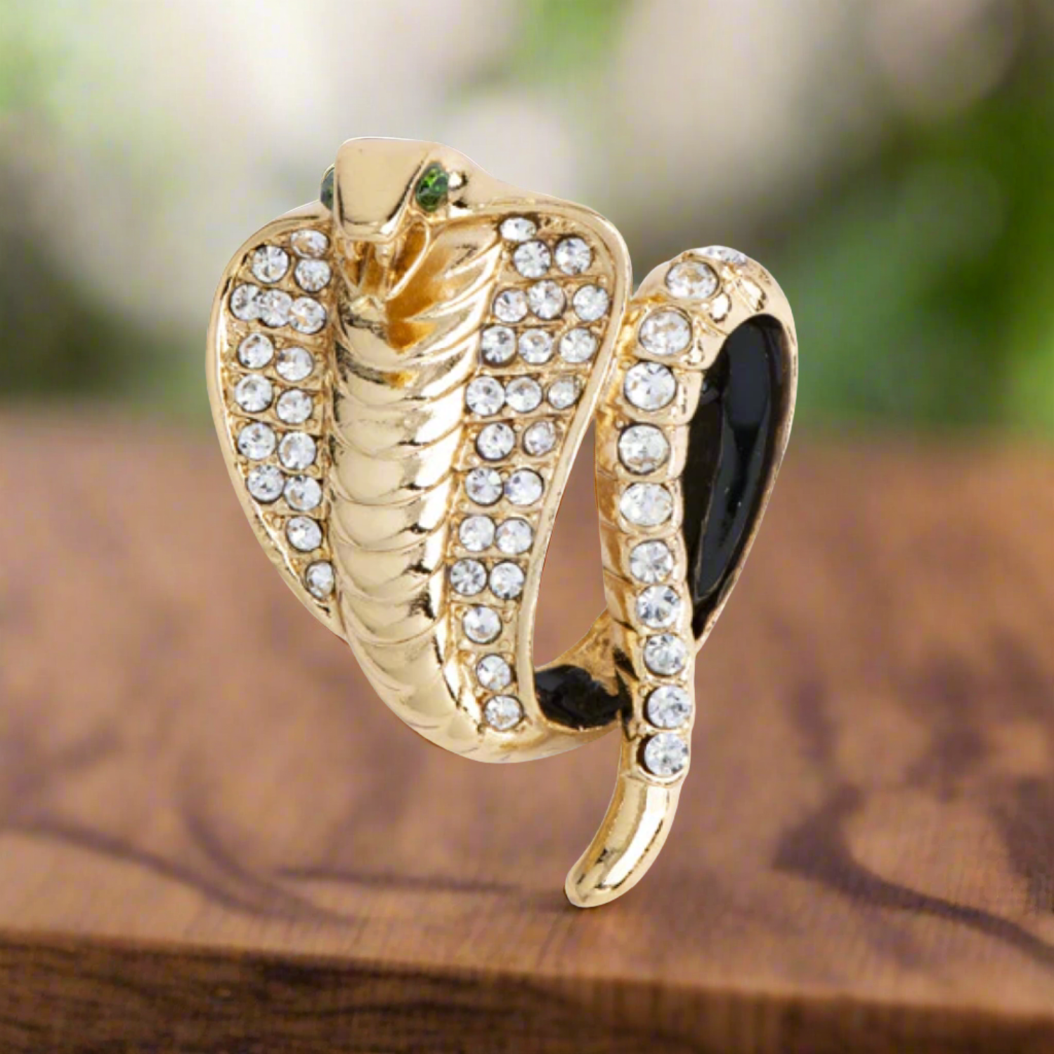 Silver cobra lapel pin on a classic suit lapel for formal events