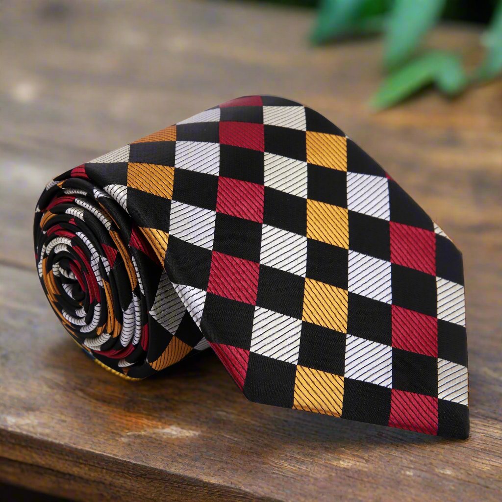 Close-up of Coltshire geometric silk tie showcasing diamond pattern and vibrant colors