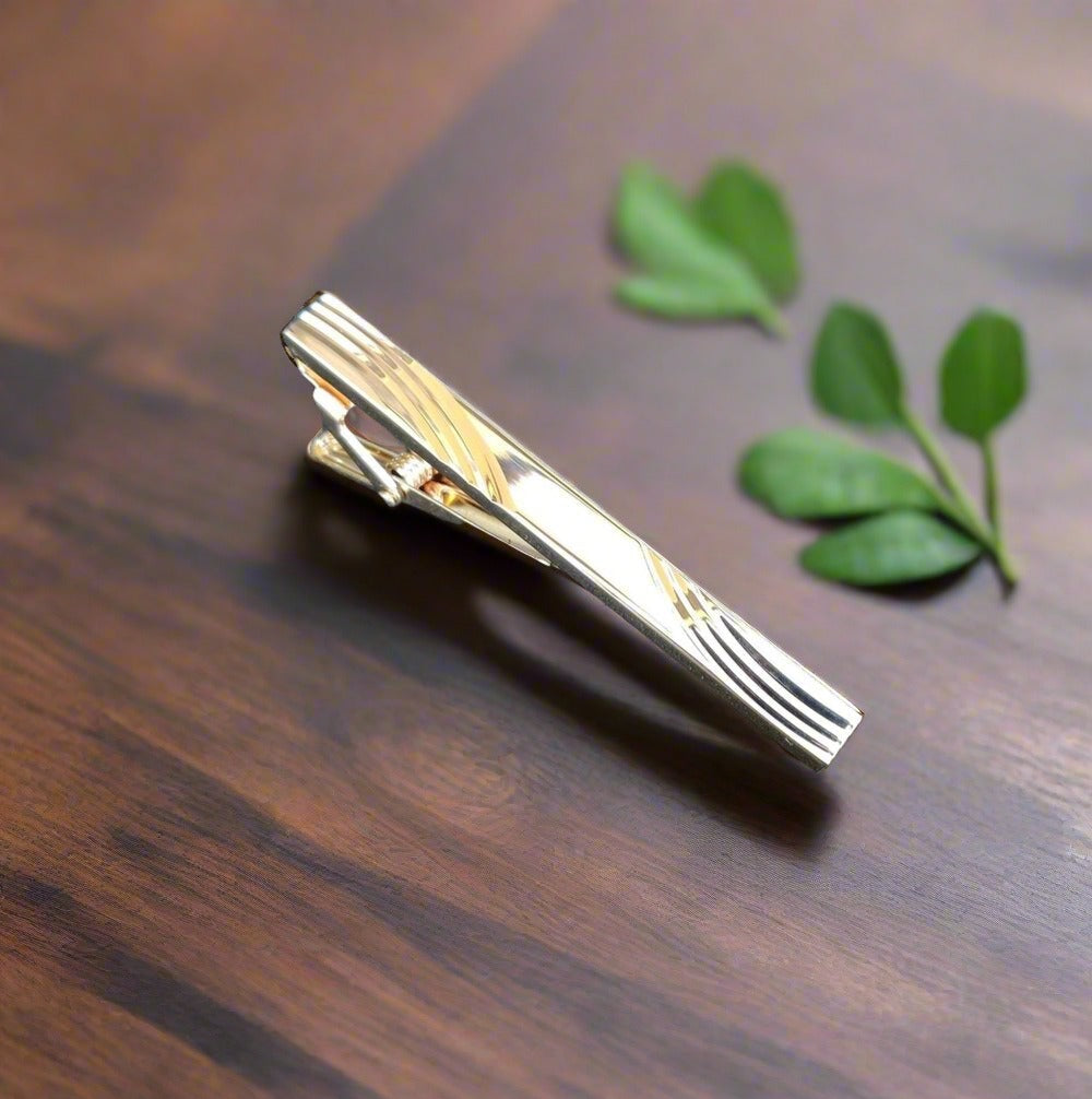 Zebra pattern tie bar with stone accents, ideal for a unique and stylish look.