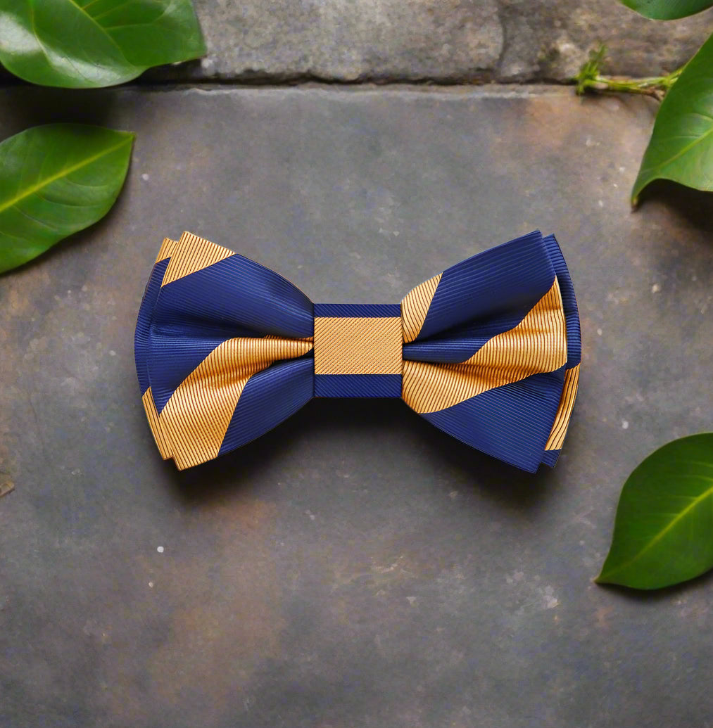 Close-up of the adjustable self-tie bow tie in yellow gold and navy blue stripes