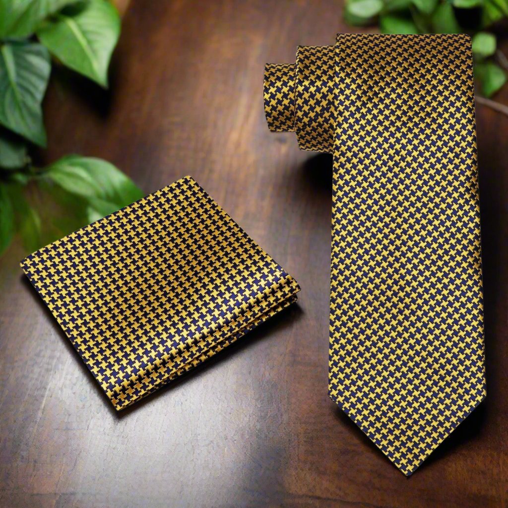 Close-up of metallic gold and black houndstooth silk necktie showcasing intricate pattern