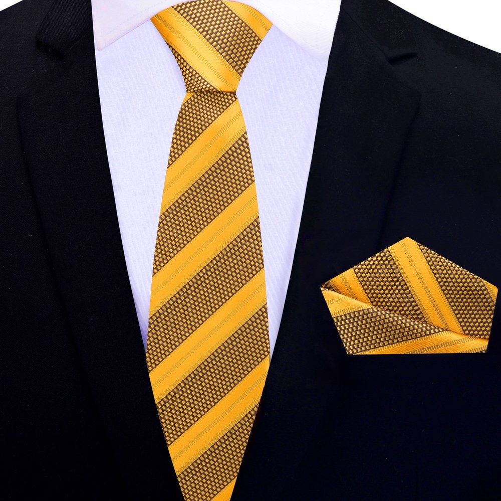 Close-up of classic striped silk necktie in blue and gold shades for business attire