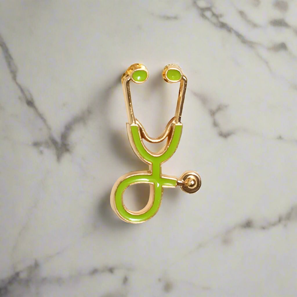Close-up of the stethoscope lapel pin on a suit jacket, emphasizing its unique design.