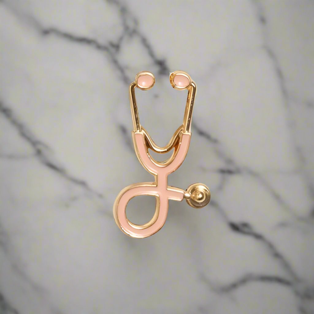 Close-up of the stethoscope lapel pin on a suit jacket, emphasizing its unique design.