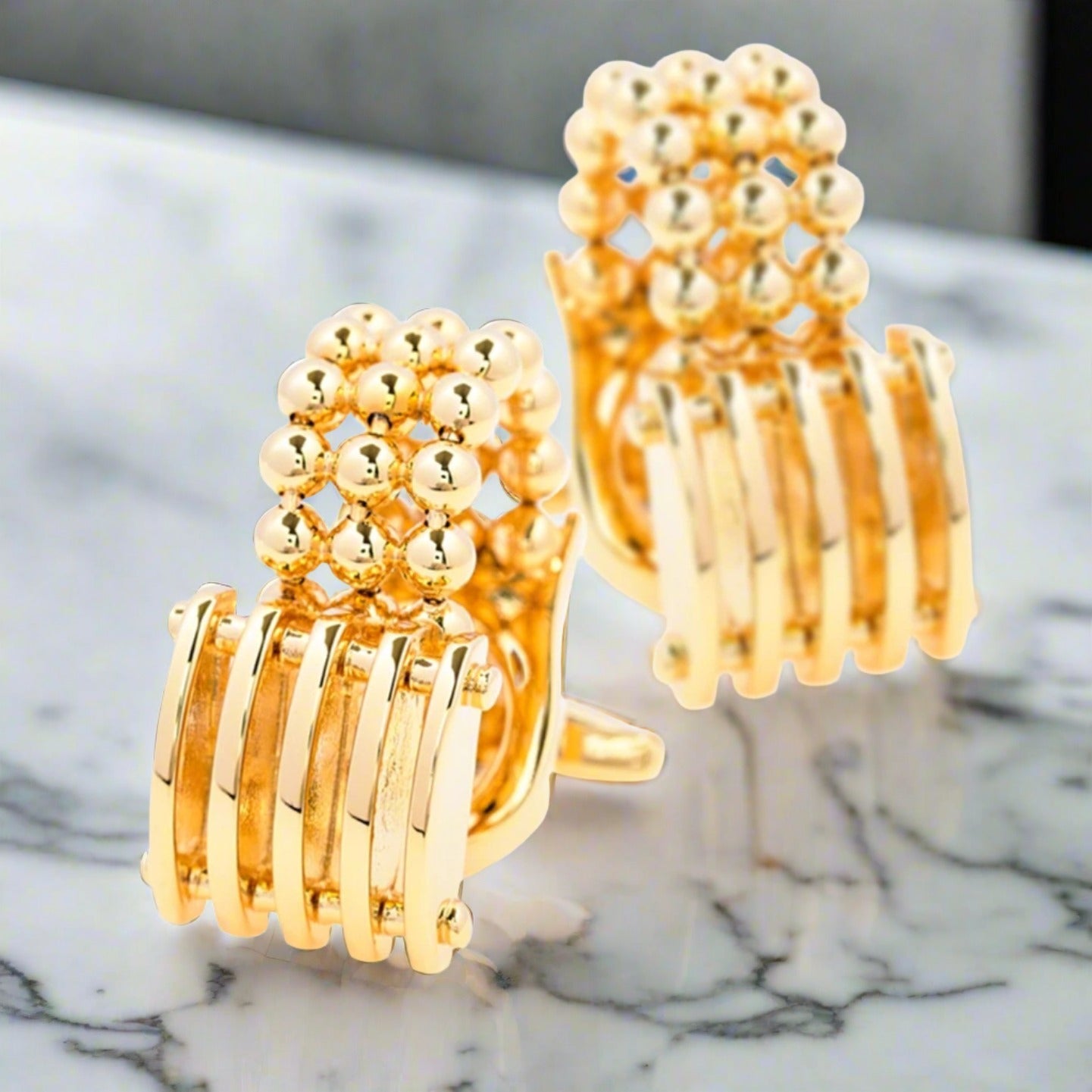 Elegant gold cufflinks with chain and small ball design for formal events