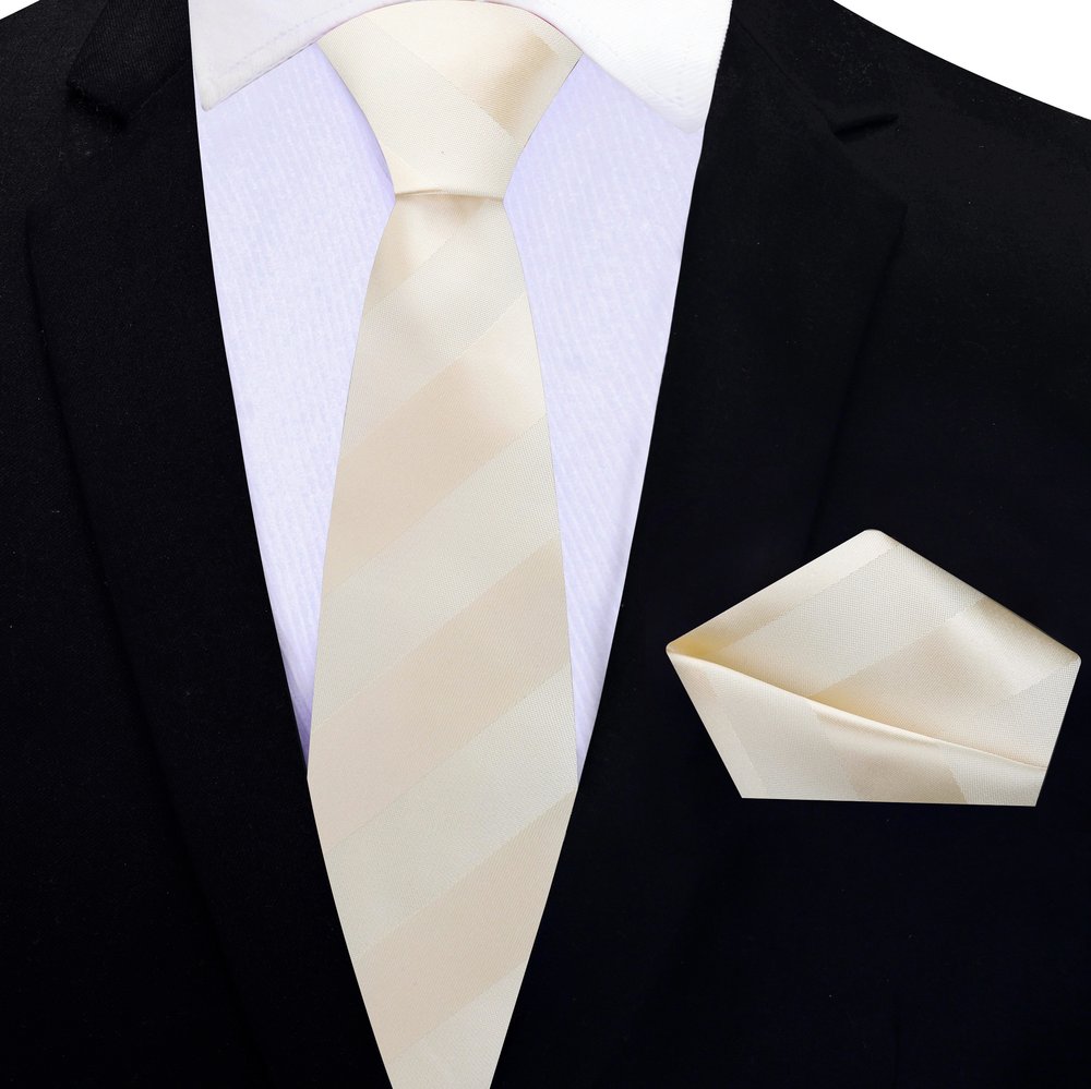 Man wearing a mens striped silk tie with a navy suit at a wedding