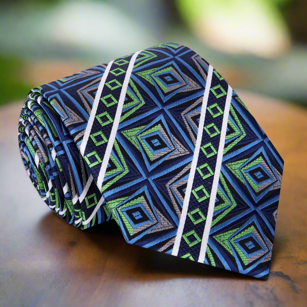 Artistic Prism Silk Necktie displayed on a white dress shirt, showcasing its vibrant abstract pattern.