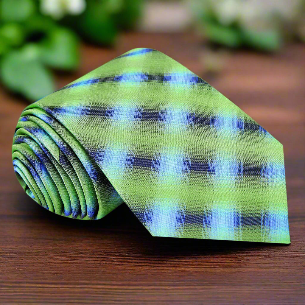 Dynamic green and blue plaid silk tie displayed on a white background.