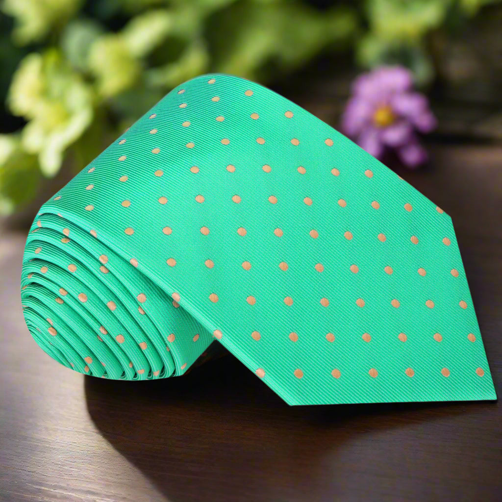 Close-up of Emeralon luxury green silk polka dot necktie showing fine details and texture.