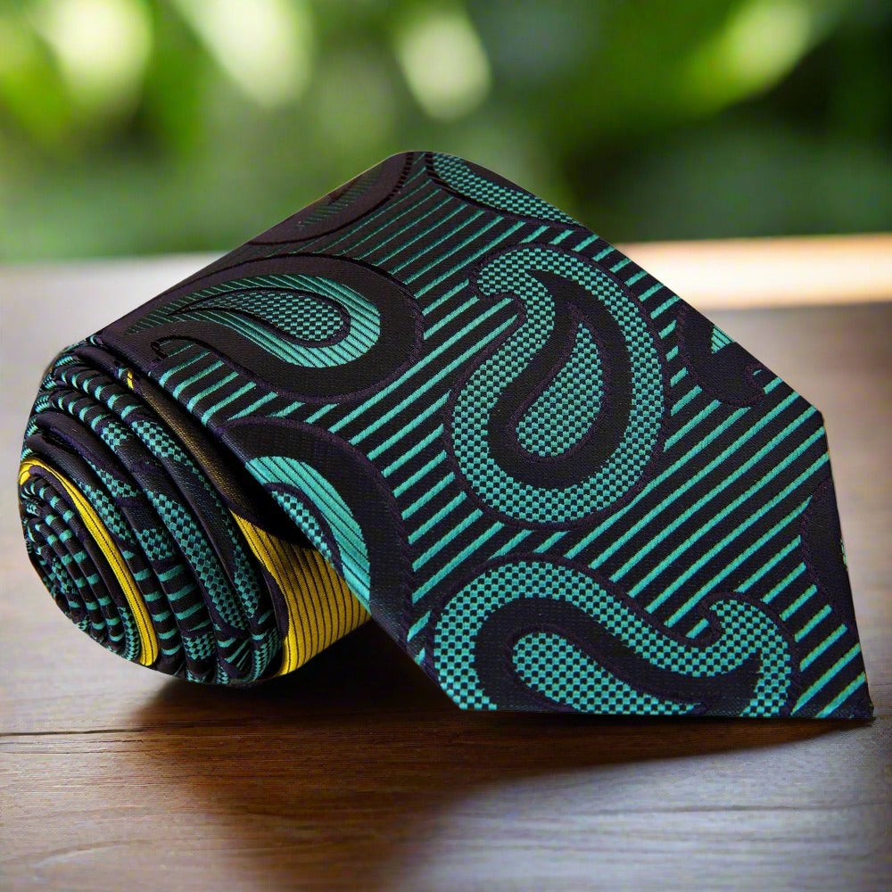 Silk paisley tie styled with a crisp white shirt and navy blazer