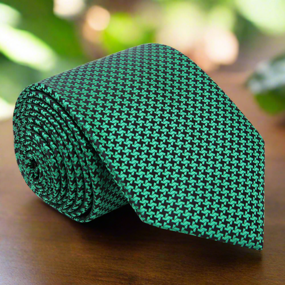 Close-up of metallic gold and black houndstooth silk necktie showcasing intricate pattern