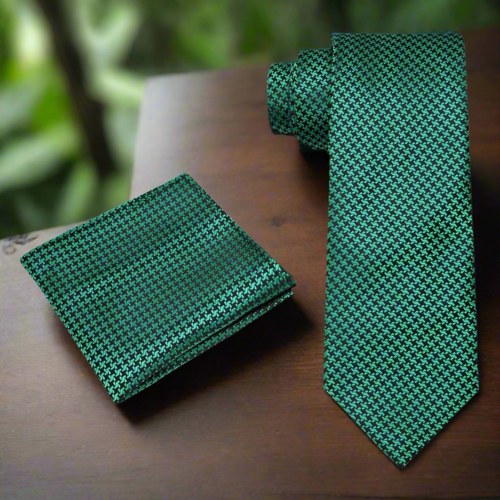 Close-up of metallic gold and black houndstooth silk necktie showcasing intricate pattern