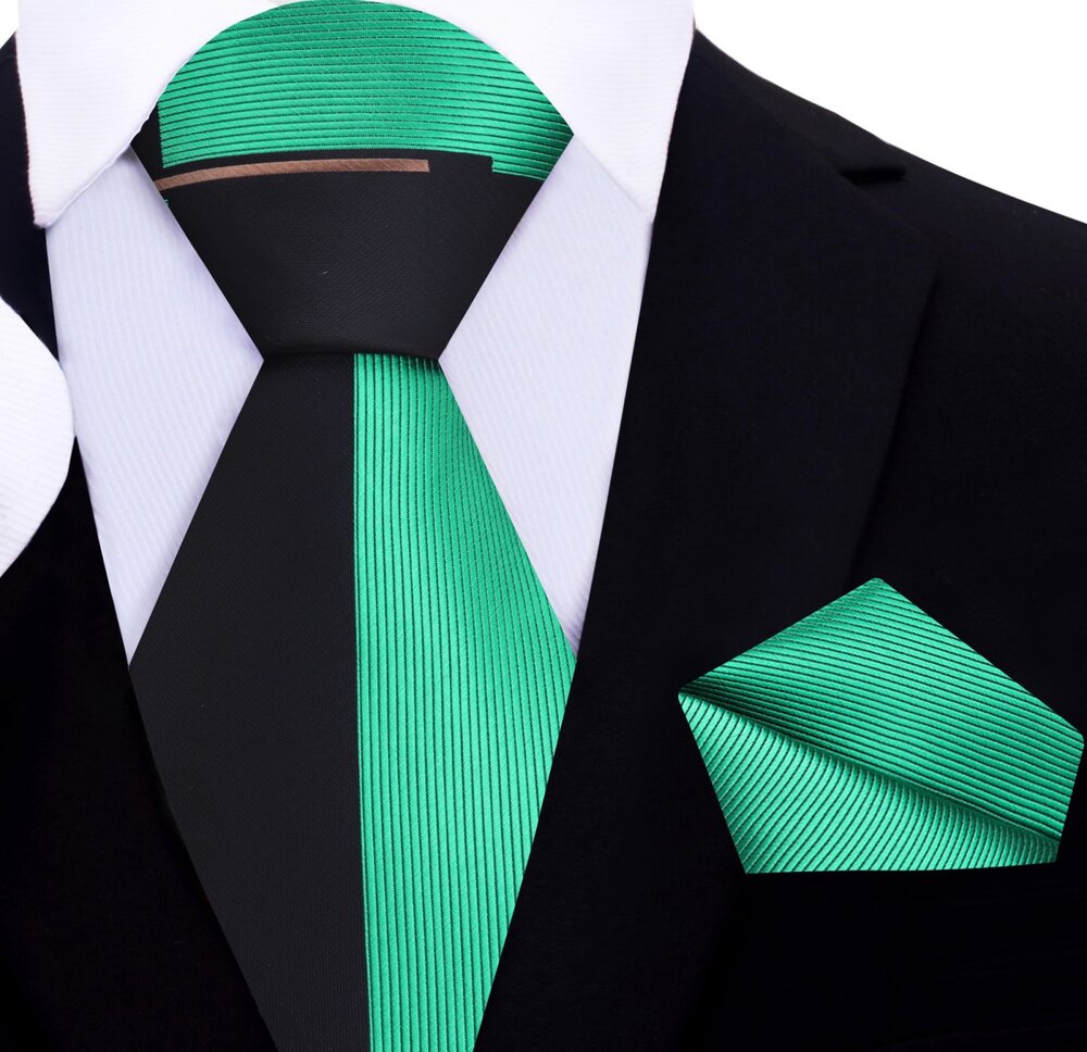 The two-toned silk necktie paired with a crisp white shirt, perfect for business.