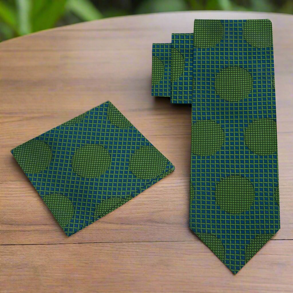 Close-up of the vibrant polka dot silk necktie, emphasizing the texture and quality of the fabric.