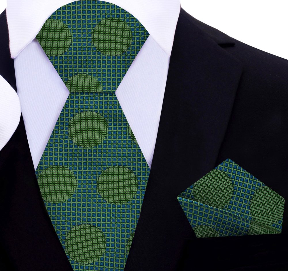 Large polka dot silk necktie in vibrant colors, showcasing the bold pattern against a white shirt.