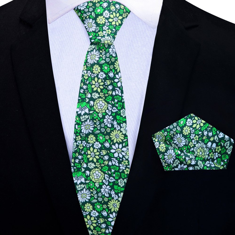 Matching pocket square for blue tie laid out on a suit jacket
