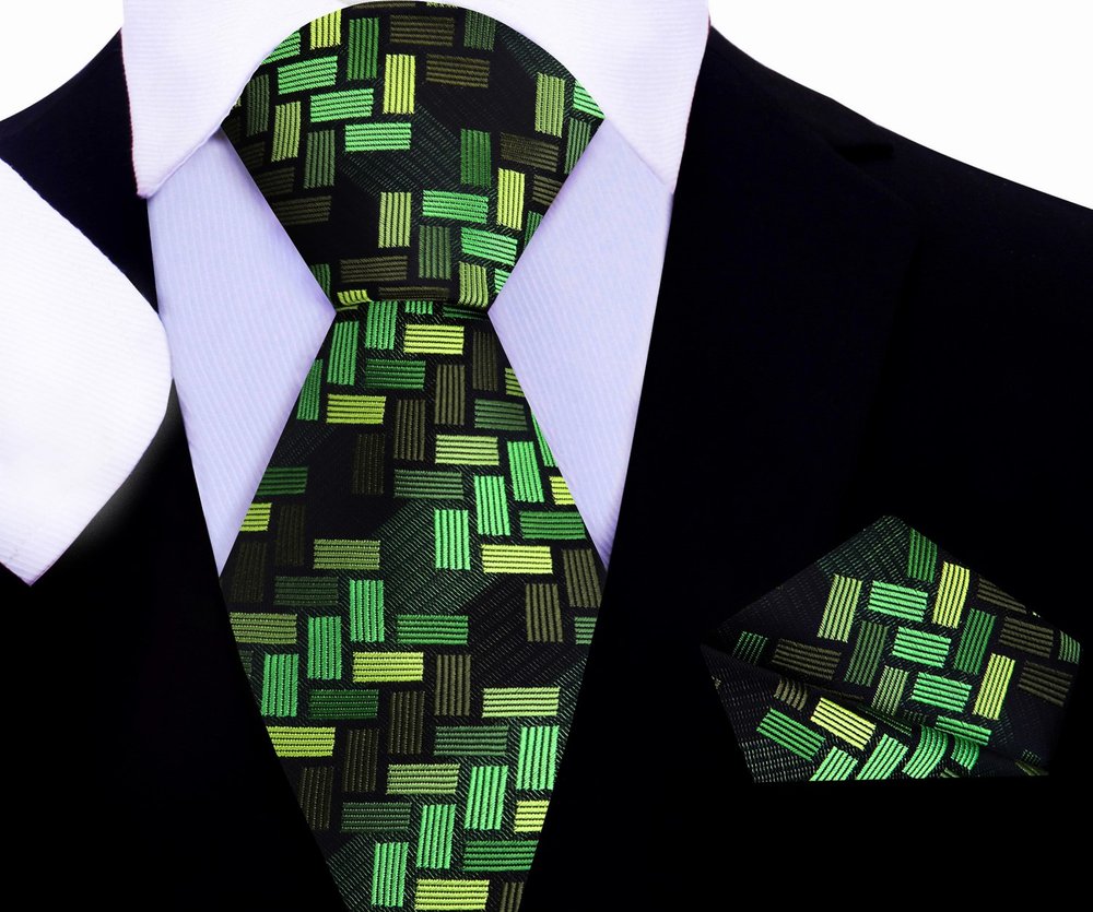Purple geometric tie displayed with a light gray suit, demonstrating a sophisticated pairing.