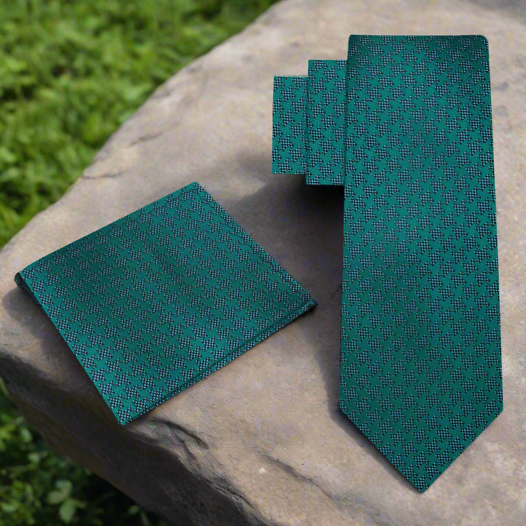 Front view of a houndstooth silk tie in green, blue, and grey with a classic pattern