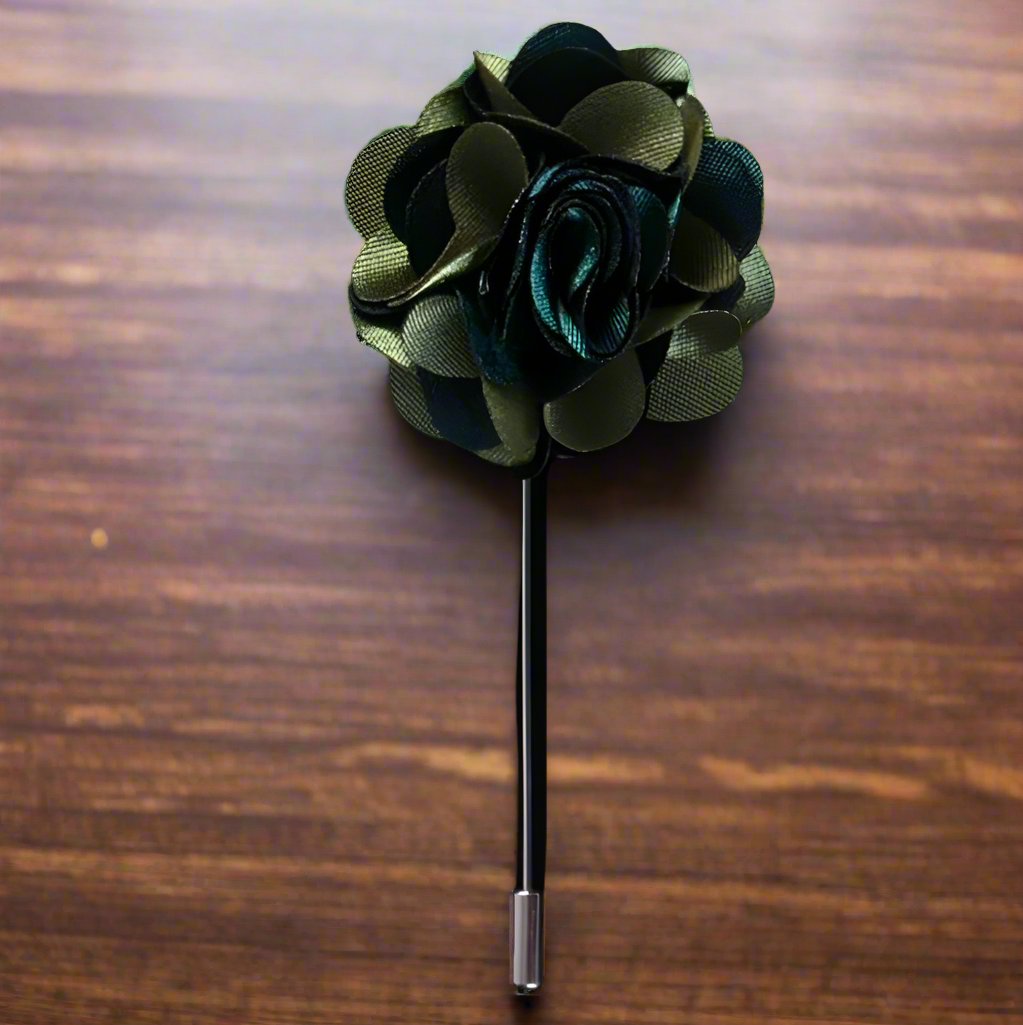 Model wearing the vibrant leaf lapel pin on a suit, highlighting its stylish appeal
