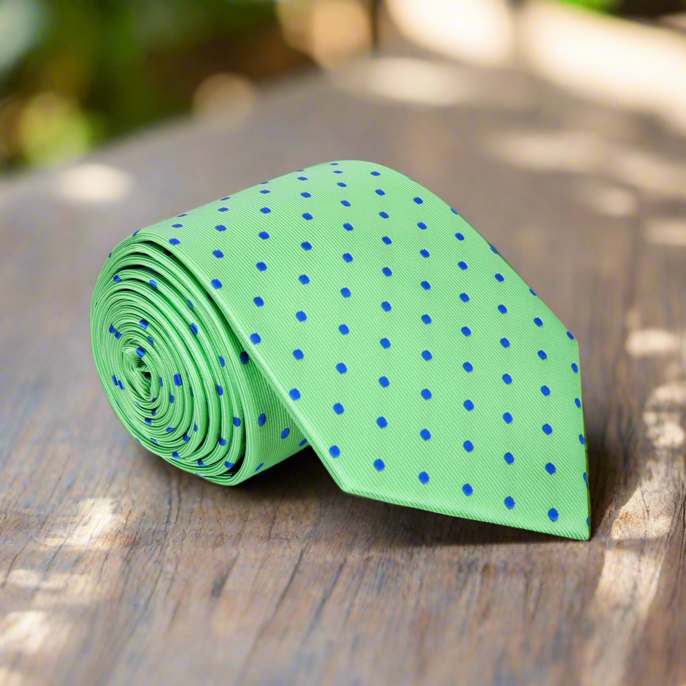 Close-up of green polka dot tie, showcasing its vibrant dots and silk texture.
